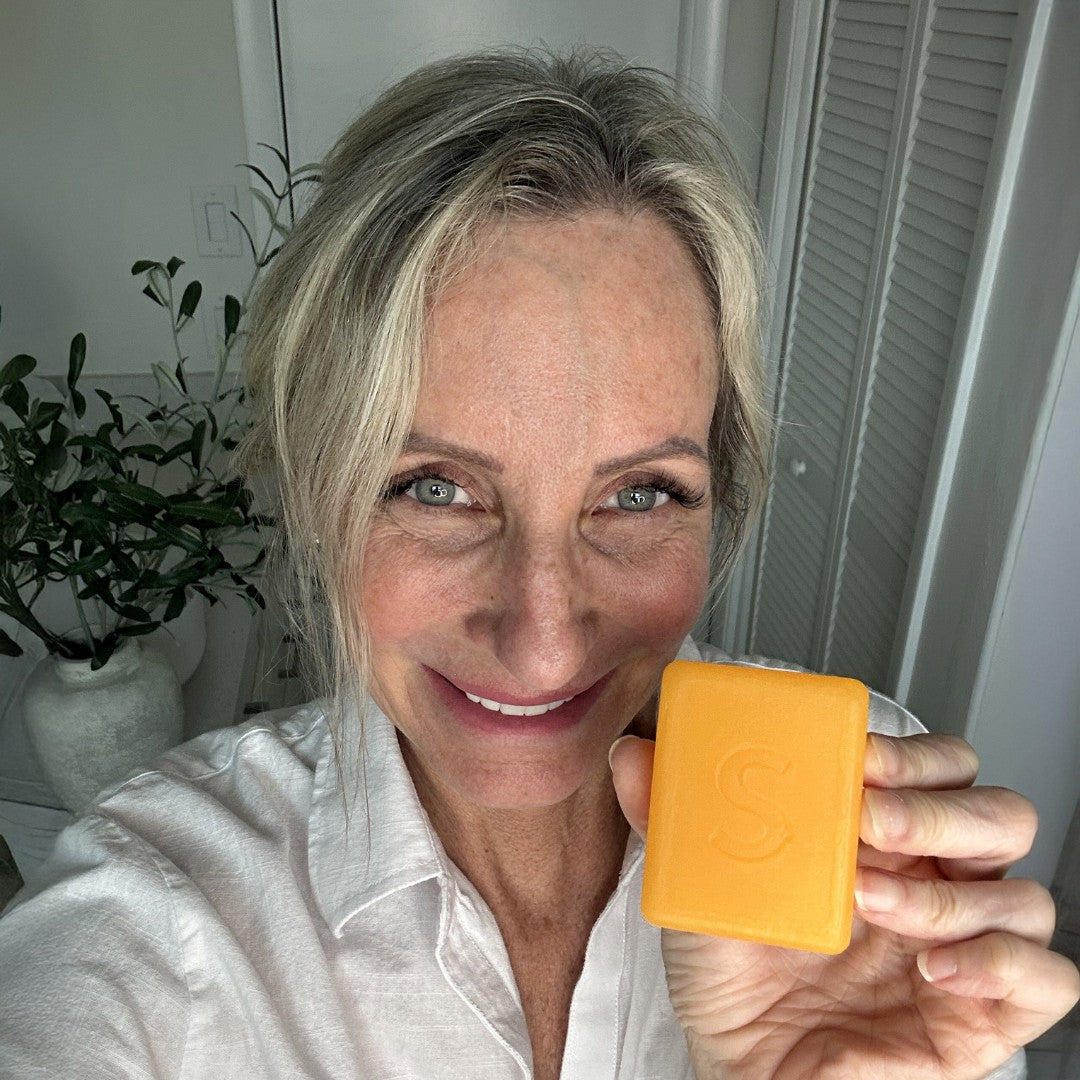 Customer holding persimmon soap